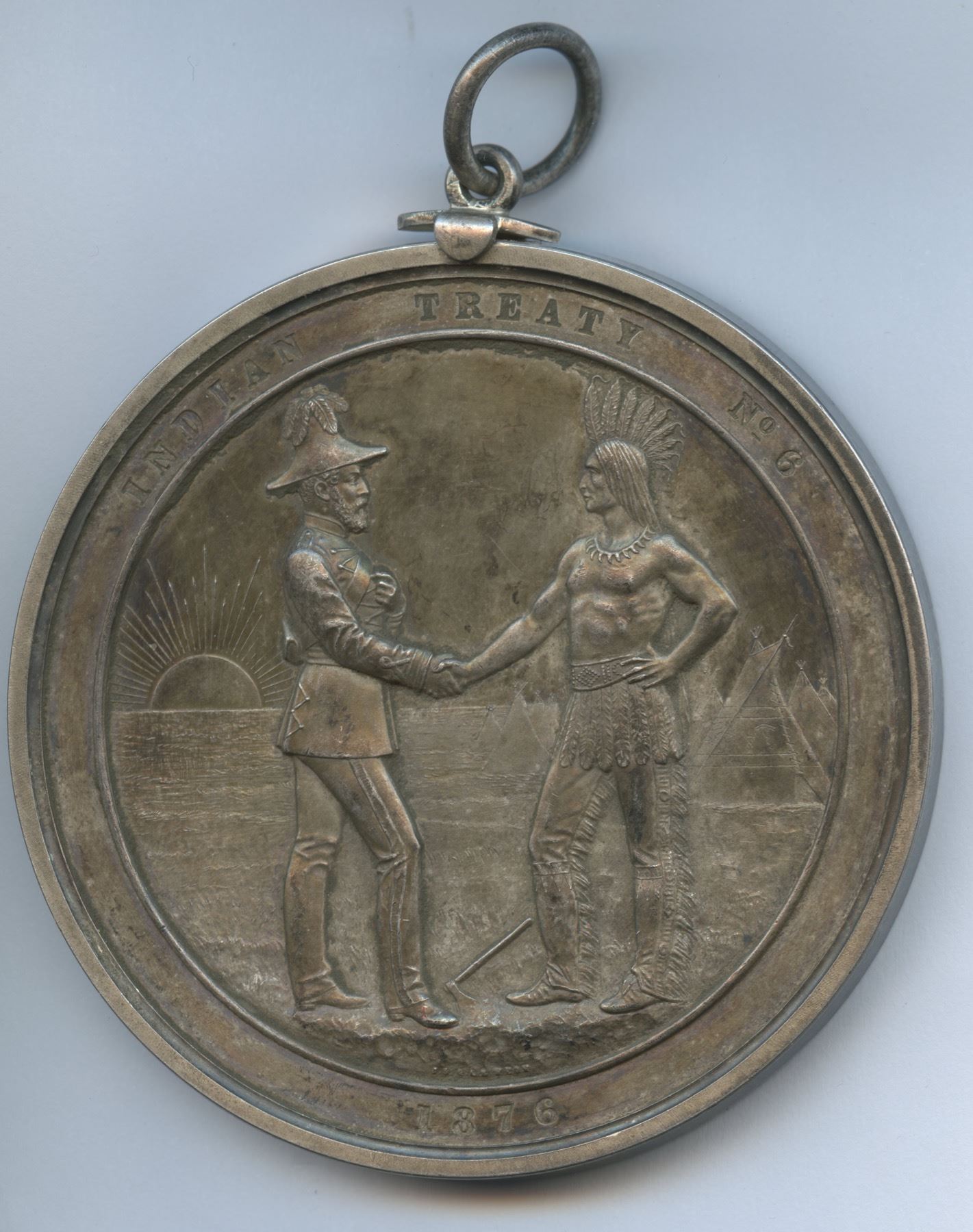 Original photograph of the Treaty 6 medal's handshake face and suspension